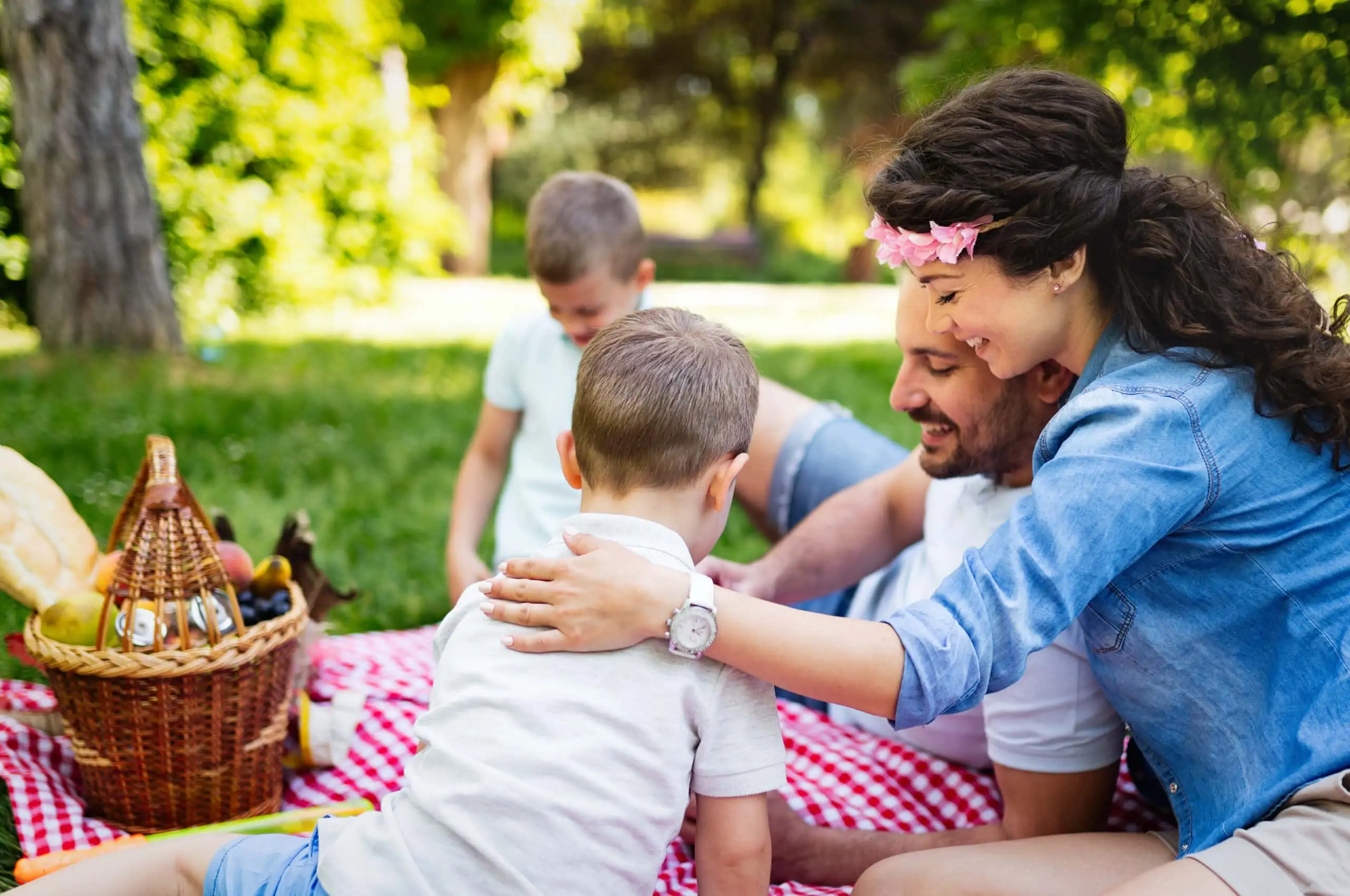 Young happy family with children having fun in nature